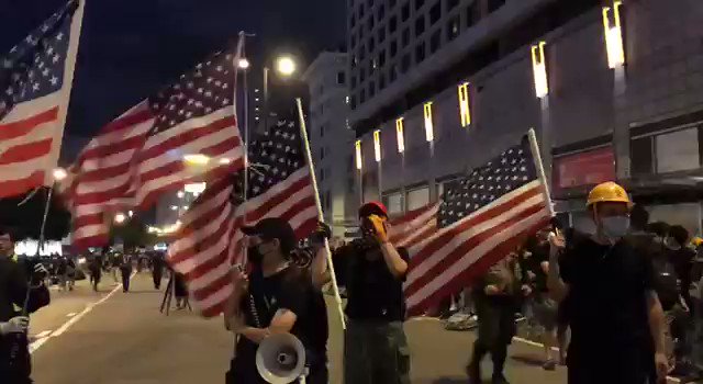 Protesters in Hong Kong waving the American flag and singing the American National anthem as they advocate for democracy. Wow!