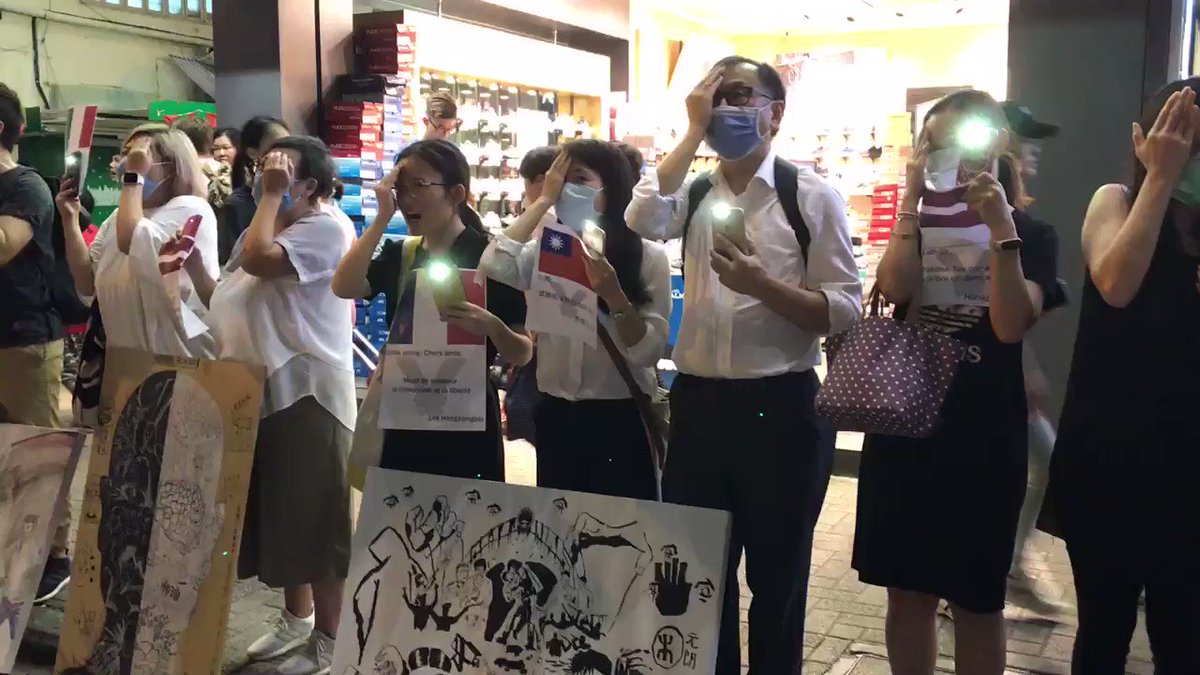 Mary Hui (@maryhui) on Twitter photo 2019-08-23 13:03:55 Now the resounding chant is 黑警還眼! Corrupt cops, return the eye! Everyone is holding up a phone light with one hand, and covering up an eye with the other—a reference to the female protester who was shot in the eye by the police with a bean bag round. Now the resounding chant is 黑警還眼! Corrupt cops, return the eye! Everyone is holding up a phone light with one hand, and covering up an eye with the other—a reference to the female protester who was shot in the eye by the police with a bean bag round.