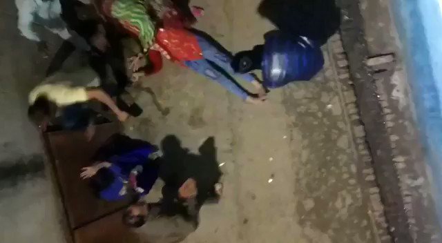 The Desi Times - Kanpur Woman Beaten To Death By Teen daughter(娘)'s Alleged Molesters A five-sec clip shot from terrace of family's home shows a woman in a red lying on the ground as a man in a white kurta and trousers hit her face with his feet  