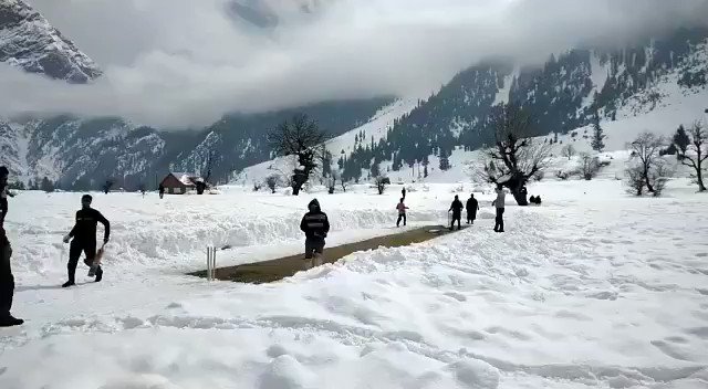 Anything for the game! This is a cricket match going on in the snow draped Gurez valley in #Kashmir
