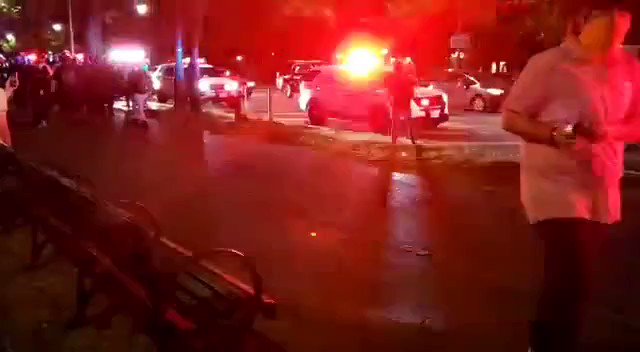 Brooklyn: Crown Heights residents cheer and salute the #NYPD as hundreds of officers in riot gear pass by on Eastern Parkway. https://t.co/P474MdnYue