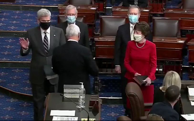 Susan Collins ( is sworn into the Senate alongside