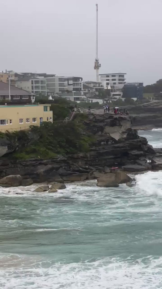Looks like #surfers were gathering to pay their respects in the rain this morning at #Tamarama. Quite beautiful. https://t.co/aT1H29LOg6