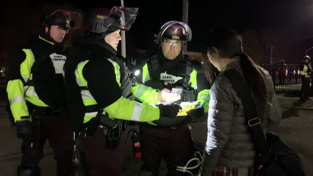 Star Tribune journalists @shijundu and @ByLizSawyer being “processed” by Minnesota Sate Patrol after documenting mass arrest tonight in Brooklyn Center. https://t.co/3NCecX8wew