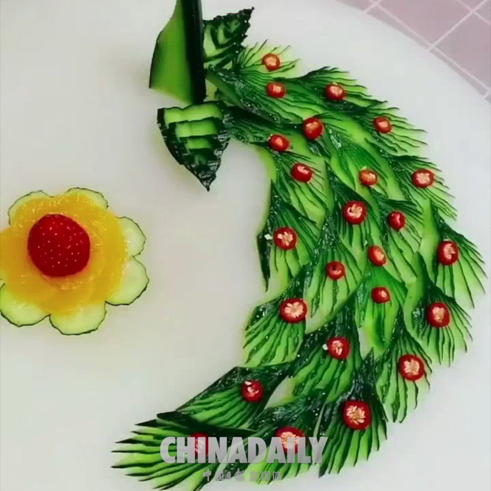 Check it out! How does a chef transform a cucumber into a vivid peacock? #TrendingNow https://t.co/E1DPNapdcH