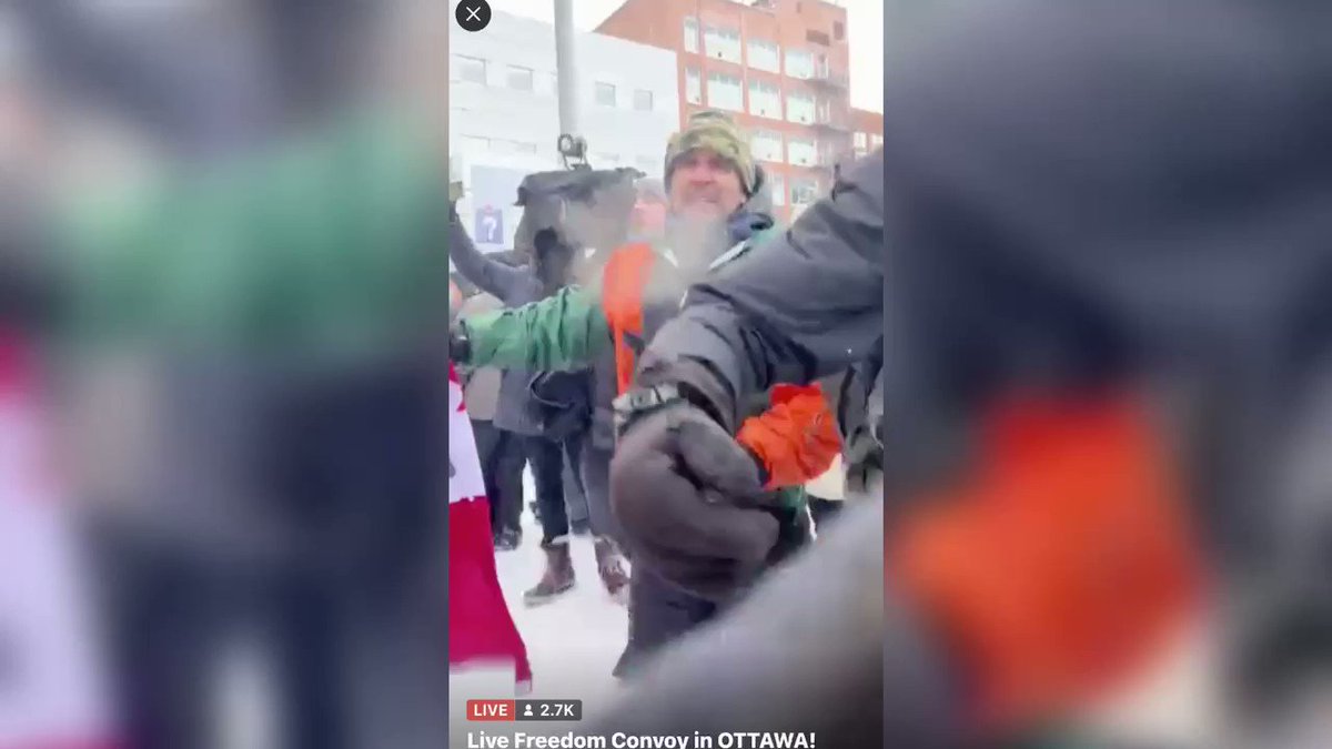 Ottowa Protestors Kneel In Prayer As They Hold The Line In Front Of Advancing Ottowa Police LqYBkOhtwY7dpOqM