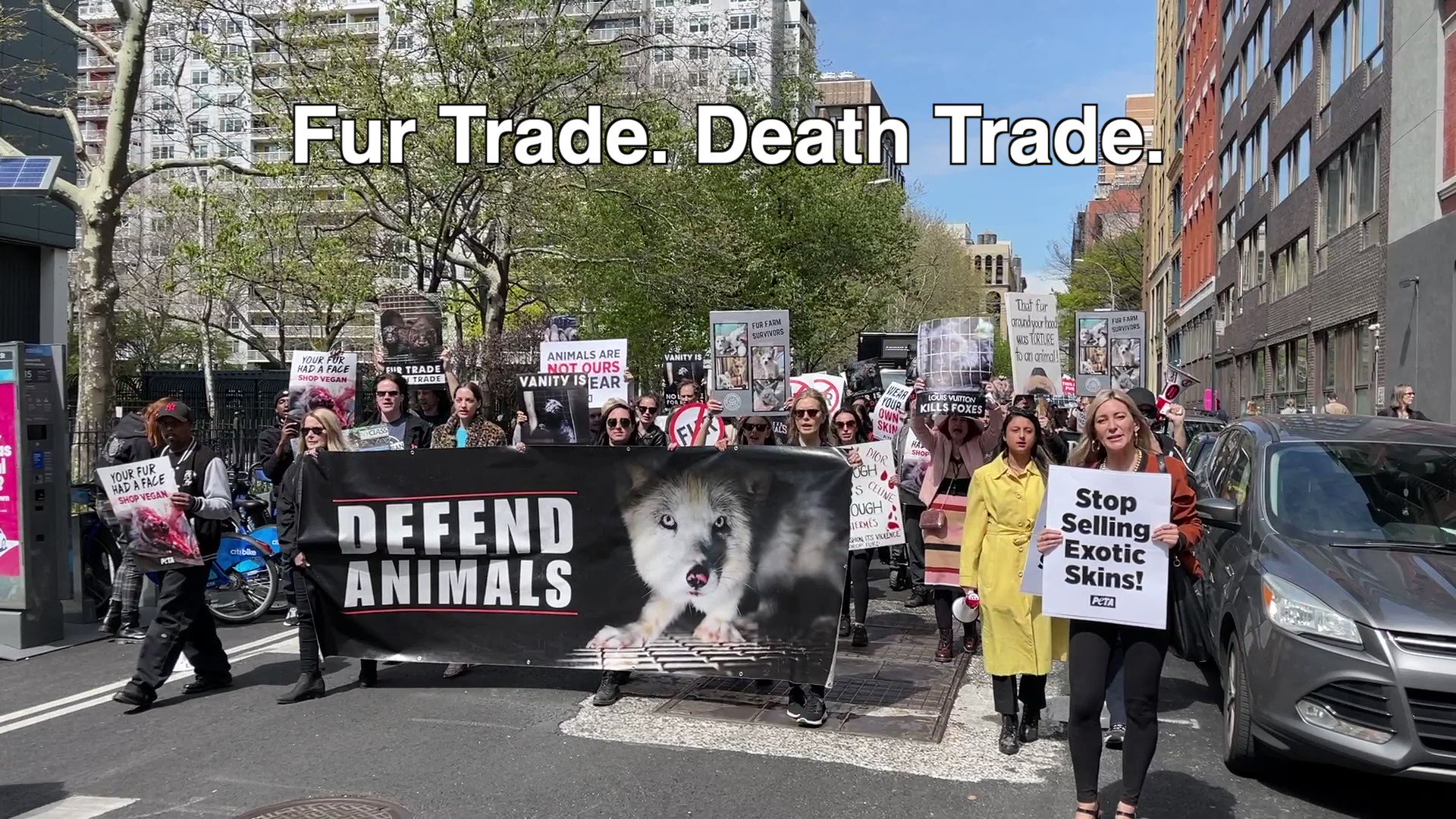 NEW YORK, NY - FEBRUARY 12: Animal Rights Protesters holding signs protest  in front of the Louis Vuitton store in SOHO during an Anti-Fur March on  February 12, 2022in New York City.