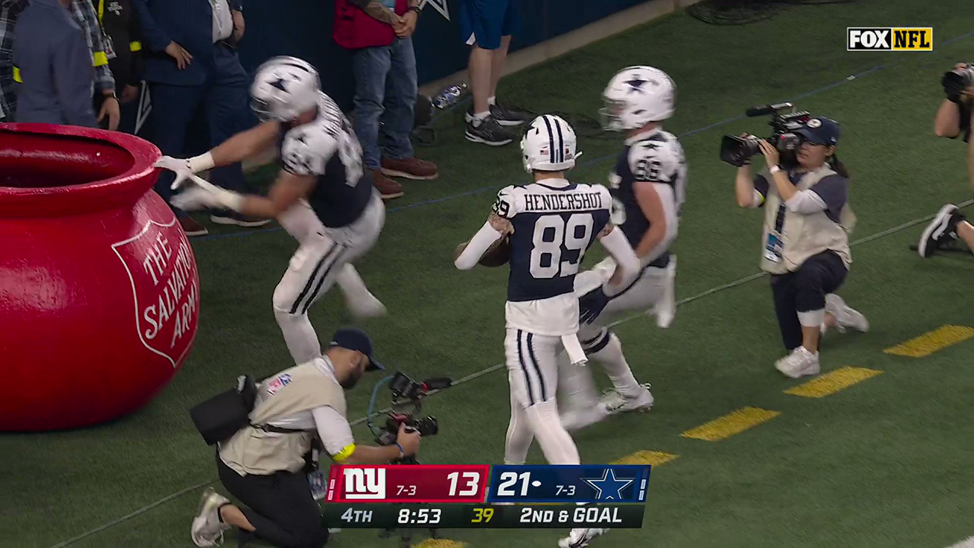 Watch: Cowboys TEs jump in Salvation Army kettle for 'Whac-A-Mole' TD  celebration