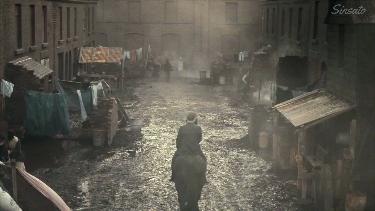 In a dusty black coat with 
a red right hand.  Happy Birthday Cillian Murphy -Tommy Shelby 