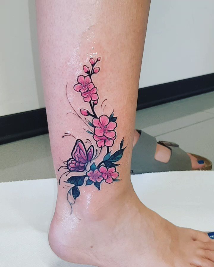 Terrific Purple Cherry Blossom Flower Tattoo On Girl Foot – Truetattoos