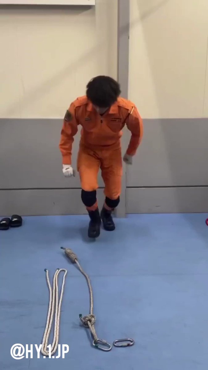 Japanese firefighter shows how to tie an emergency rappelling harness