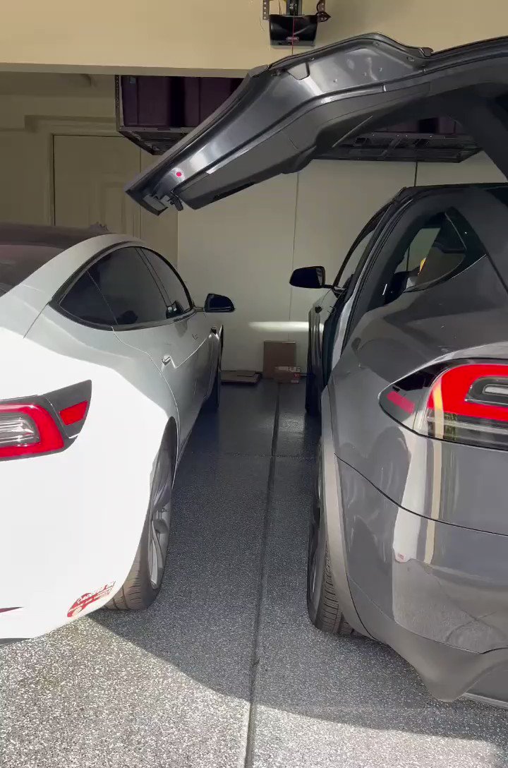 Model x doors in garage deals