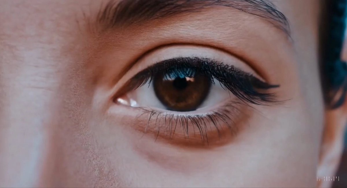 Extreme close up of a 24 year old woman’s eye blinking, standing in Marrakech during magic hour, cinematic film shot in 70mm, depth of field, vivid colors, cinematic