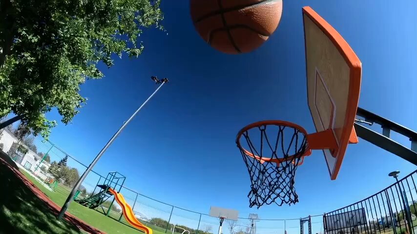 Basketball through hoop then explodes.