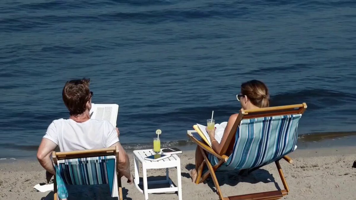 Video Poster for realistic video of people relaxing at beach, then a shark jumps out of the water halfway through and surprises everyone