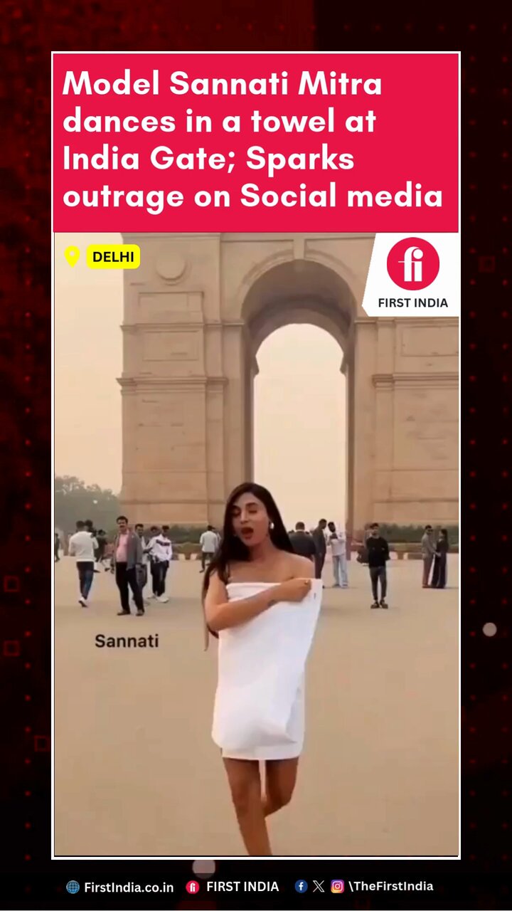 Close-up of a woman's face with a mischievous smile amidst a public setting