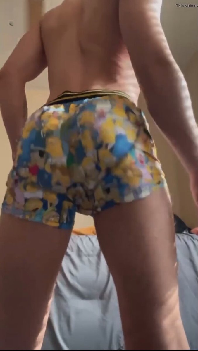 a man's hand positioning the dildo