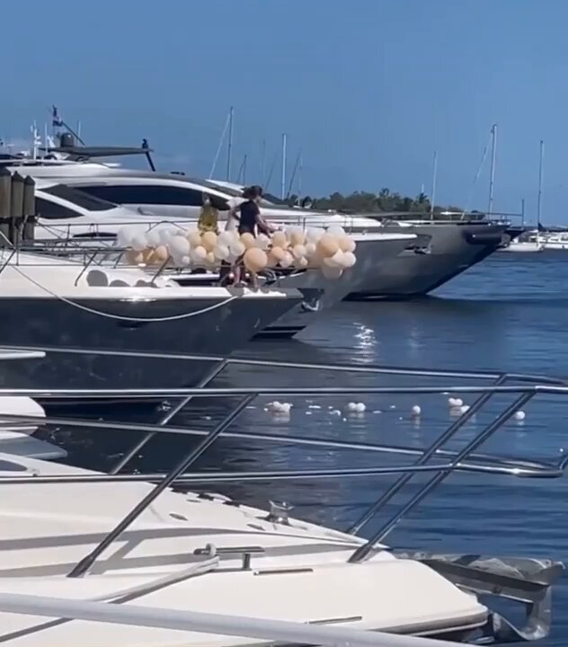 Scumbags pop balloons directly into the ocean after a yacht party 