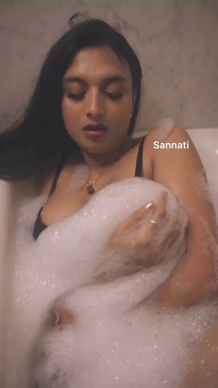 Sannati looks playful as she tempts more