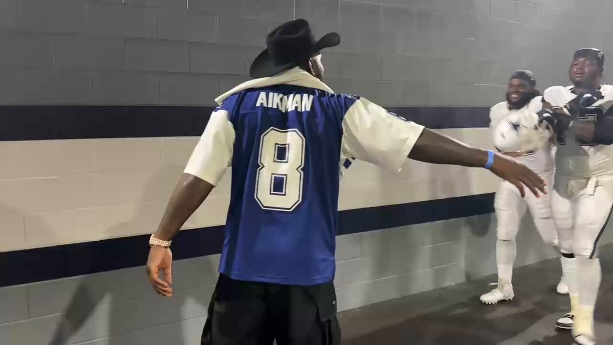 Cowboys win and Dez Bryant greets everybody in the tunnel to locker room. 