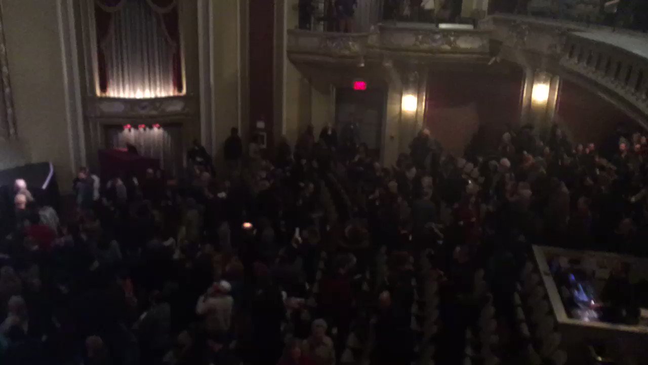 sings happy birthday to Angela Davis as she concludes her lecture   