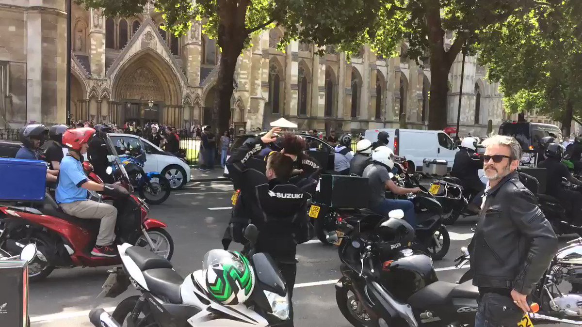 Hundreds of food delivery drivers beeping through City streets