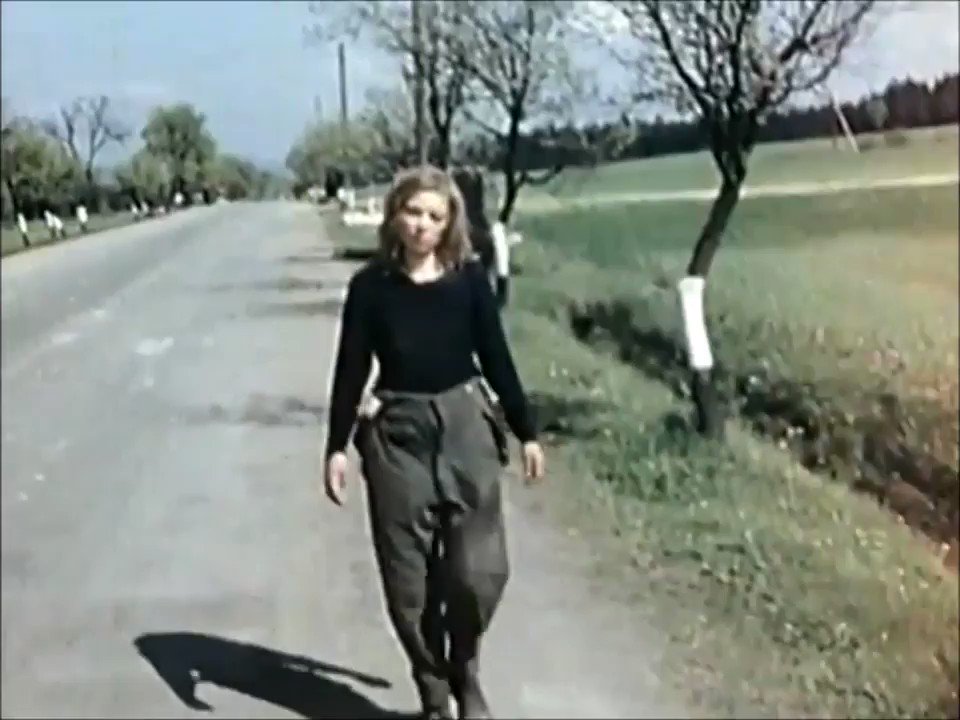 WWII Pictures - "Lost German Girl", a beaten woman filmed on a country road near the Czech border during the surrender of Wehrmacht troops. Her identity is still unknown.  This footage was filmed 73 years ago today. #WW2