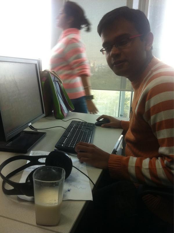 PadmajaJoshi's tweet photo. Colleague @ritanrex gets serious protein boost while working the desk for #HTGujarat #milkrules http://t.co/0ZHqaspm