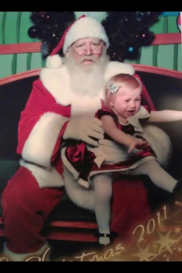 My niece last Christmas with Santa... I think she loved him.