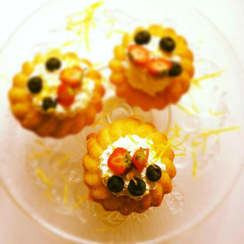 Lemon &amp; ginger sponge filled with fresh cream then topped with berries x.
they all just been made