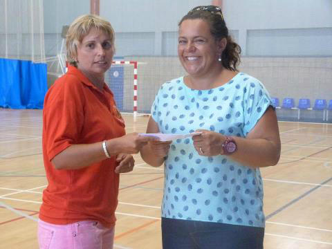 Tracey Baglietto who organised the 5 - a - side Ladies Football Tournament handing over the cheque for £250. Thank you
