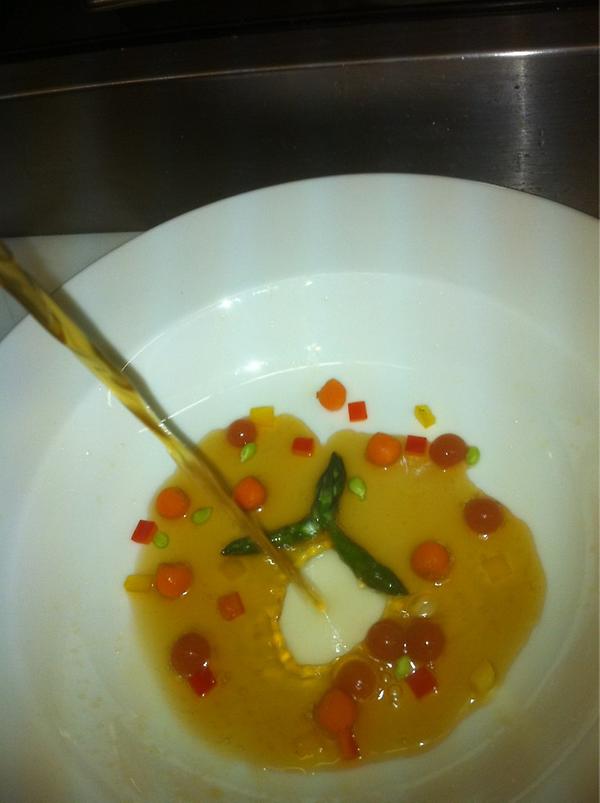 EdwardZindleIII's tweet photo. Consommé with spherical tomato, asparagus tips poured Tableside #BlackMountainGrill http://t.co/hVlwxIZm