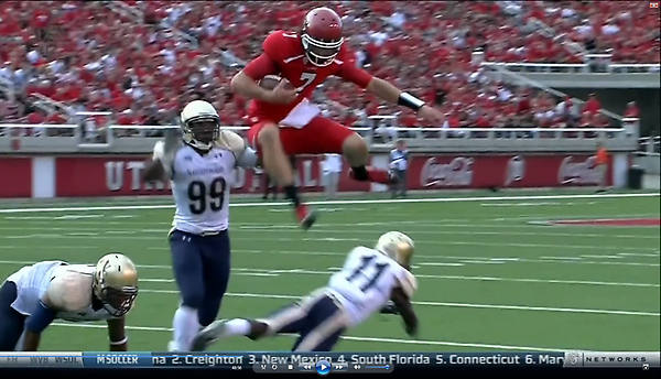 MichaelRueckert's tweet image. Screenshot of Travis Wilson hurdling a defender in his first snap of college football #MadHops