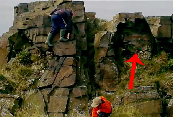 this is a pic of my son climbing on the moors on saturday, check out the face in the rock, weird