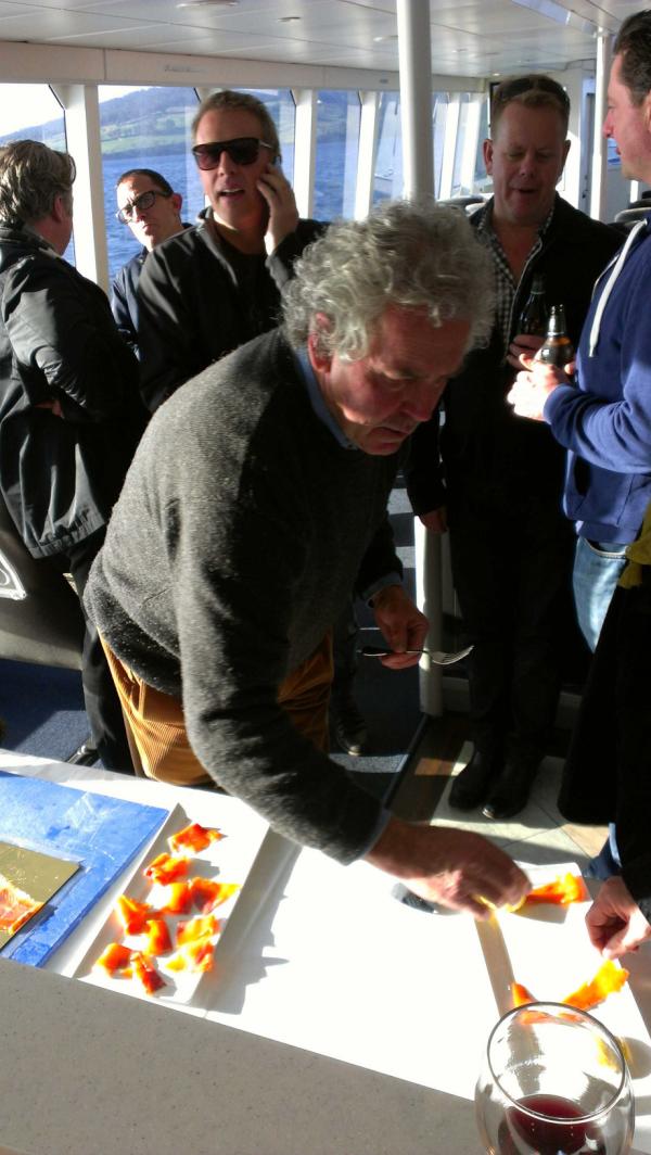 PeppermintBay's tweet photo. Roger Scales onboard today  slicing up some of his fresh Woodbridge smokehouse ocean trout! http://t.co/DK529kPD