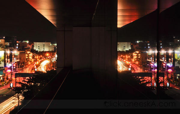 City Lights over Domlur Bridge reflected on the glass works of Mistral Solutions Pvt. Ltd.