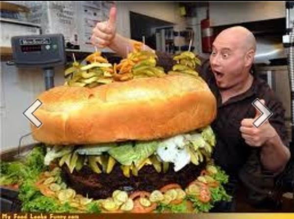 guinnesbook's tweet photo. Holy shit... Worlds largest hamburger! #wc http://t.co/LX8PPTpD