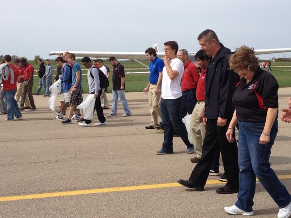 UCMWAI's tweet photo. Our members like to STAND UP for safety!! We're doing a FOD check keep our @UCentralMO  airfield safe. #girlsflytoo http://t.co/8QdfsmU0