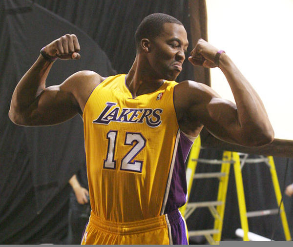 RT:@si_vault Dwight Howard admires his muscles during Lakers Media Day