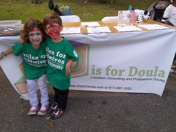 Spiderman and a flamingo helping out <a href="/DisforDoula/">Sara Newman</a> at #M4M2012NYC.