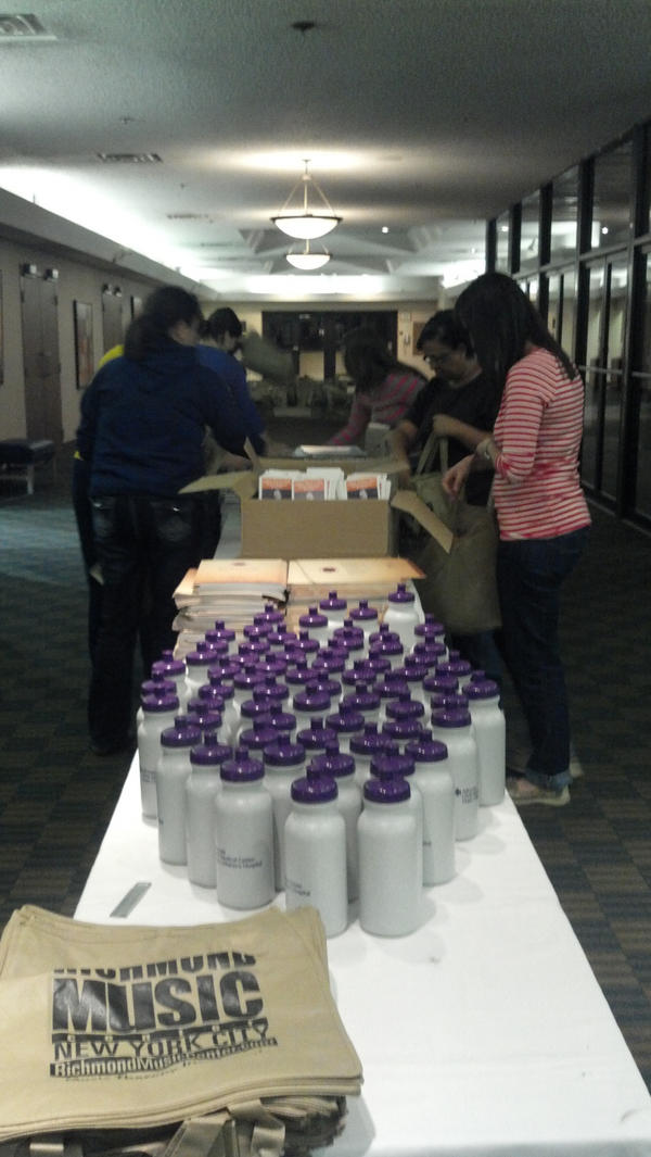 AMTA2012's tweet image. #AMTA12 hospitality committee (and friends) spent this evening stuffing conference bags! #musictherapy #awesomegoodies