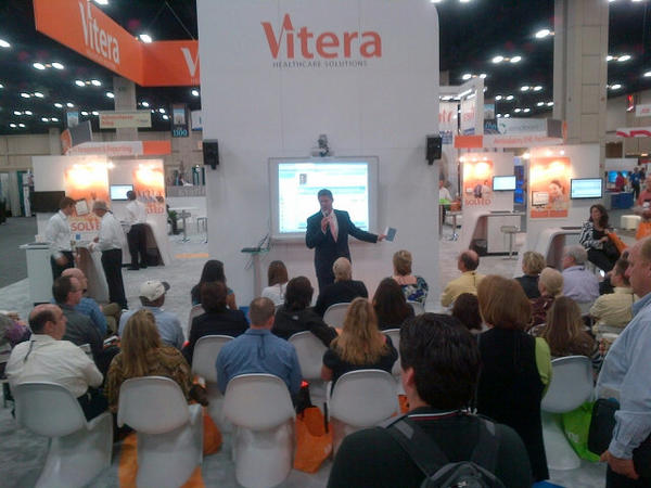 DanielHirt's tweet photo. @hawkmj launches Vitera Intergy Mobile and Vitera Stat to a standing room only crowd at #MGMA12 @ViteraHealth http://t.co/RthZLhCb
