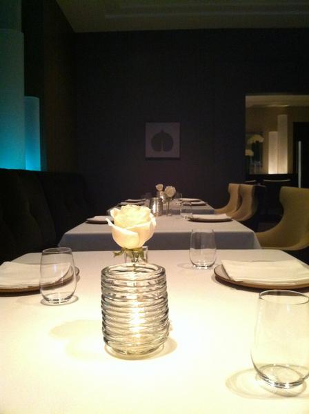 Alinea- complete with tablecloths, candles, flowers, and our leaves
