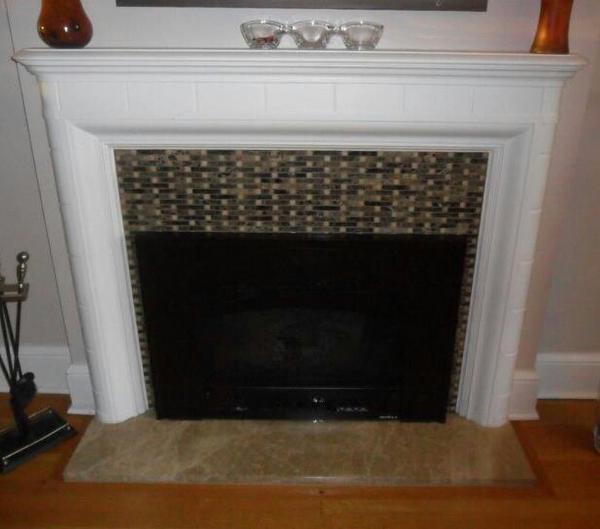 After picture! Updated 1930s fireplace with new gas insert. Beautiful!