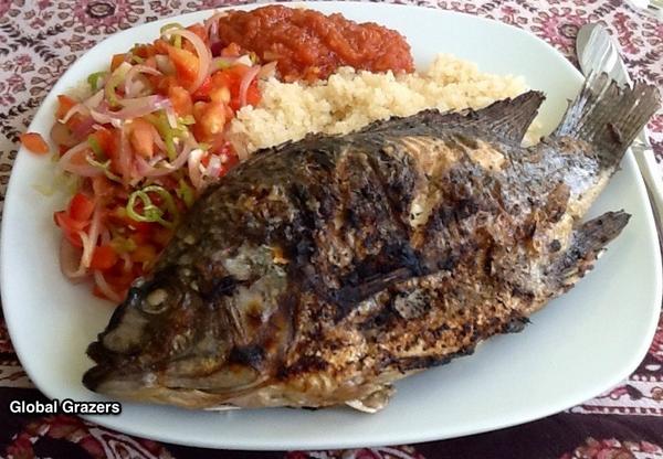 global_grazers's tweet photo. Photo: Typical Poisson Braisé (Grilled Fish) Lunch in #IvoryCoast #AfriTravel #travel http://t.co/8xobPgHm #Africa