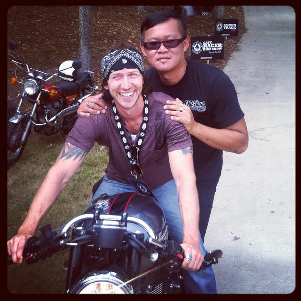 CafeRacerTV's tweet photo. Tai Truong tries to make Jason Michael's bike a two seater at #BVF2012 and #acecornerbarber. Send us your photos! http://t.co/IUER7kdk