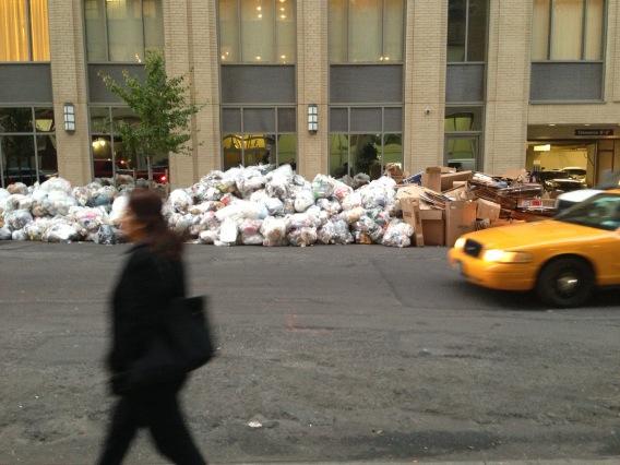 Vishinsky's tweet image. NYC street is filled with garbage.