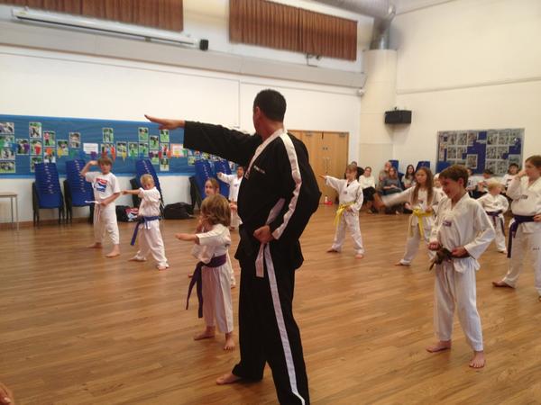 lucy_fear's tweet photo. @Matt_Fiddes @TeamFiddes @thebridportnews Master Fiddes at work with Junior students at Sir John Colfox School http://t.co/LRiek0A1