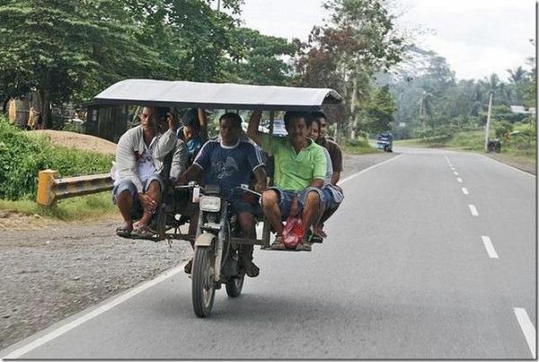 ShashiTharoor's tweet photo. Amazing example of jugaad - a desi MPV on 2 wheels that seats 6, doesn't need air-conditioning or power windows! http://t.co/PULoRxZc