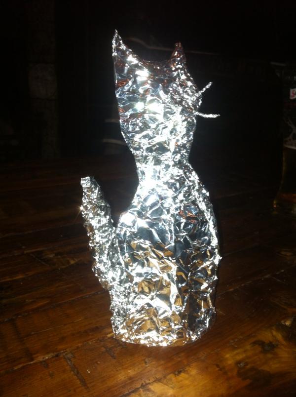 OutGuider's tweet image. Pub quiz cat sculpture